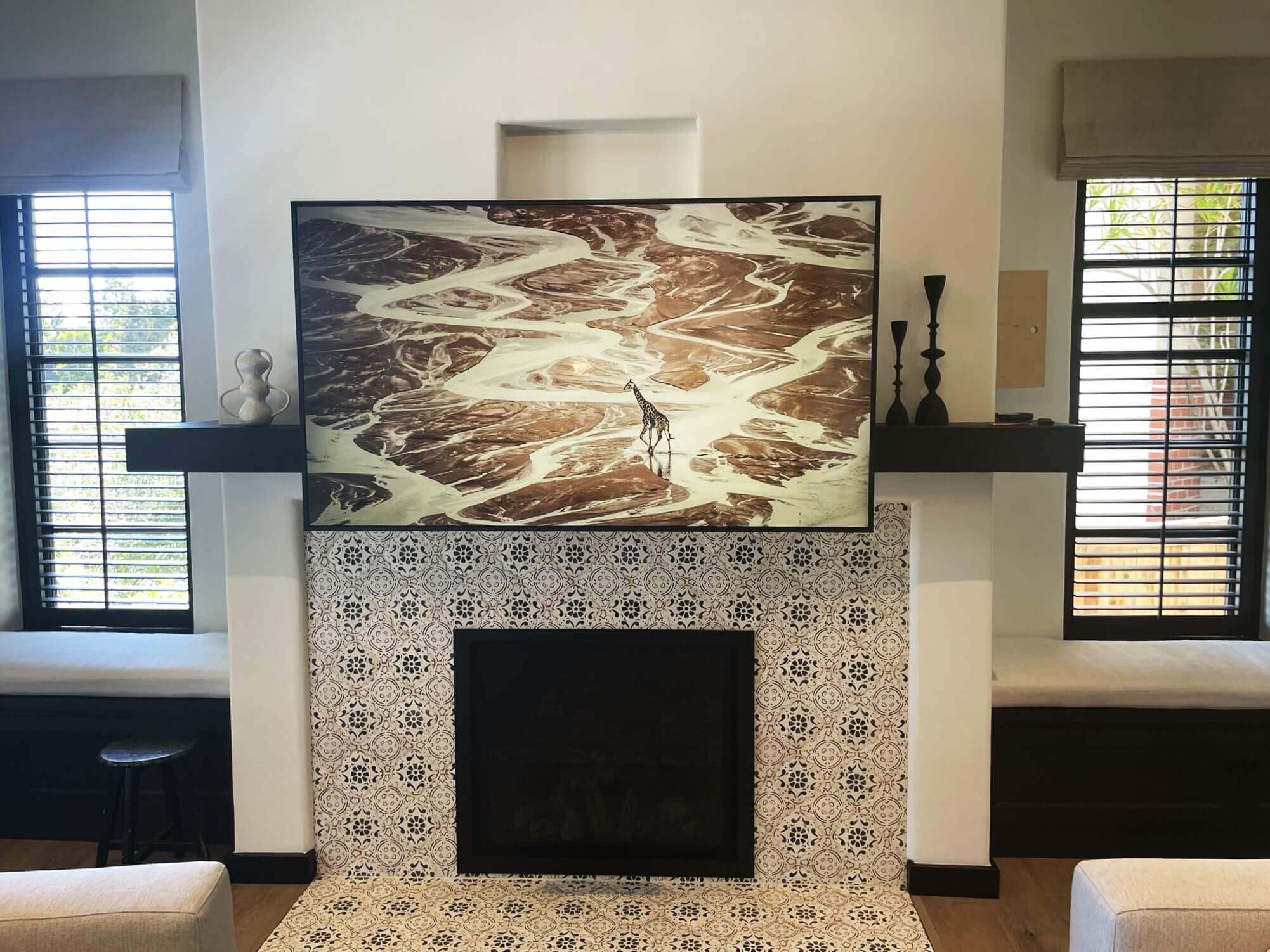 Television installed above fireplace